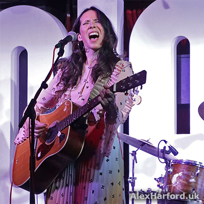 Nerina Pallot sings with acoustic guitar.